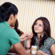 Couple flirting over a glass of wine