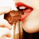 Woman eating chocolate