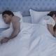 Upset couple in bed