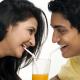 Loving couple share a juice