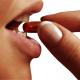 Woman taking a pill