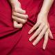 Orgasms: hands grabbing the sheet