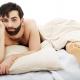 Sad man after sex in bed