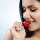 Sexy girl eating a strawberry