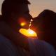 Silhouette of man and woman kissing