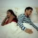 Unhappy couple in bed