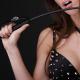 Woman with a whip and black lingerie